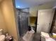 Modern bathroom features tiled shower and vanity with storage at 2094 Penn Dr, Deland, FL 32724
