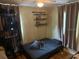 Small bedroom with ceiling fan and hardwood floors at 2094 Penn Dr, Deland, FL 32724