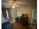 Bedroom with ceiling fan, hardwood floors, and closet at 2094 Penn Dr, Deland, FL 32724