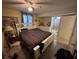 Comfortable bedroom with tiled floors, a ceiling fan and natural light at 2094 Penn Dr, Deland, FL 32724