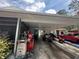 Open carport with ample storage space at 2094 Penn Dr, Deland, FL 32724