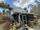 Exterior side view of the home featuring a screened-in porch at 2094 Penn Dr, Deland, FL 32724