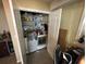 Clean and well-organized laundry area with modern appliances and storage shelves at 2094 Penn Dr, Deland, FL 32724