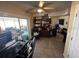 Well-lit living area with tile flooring and sliding glass doors to the outside at 2094 Penn Dr, Deland, FL 32724