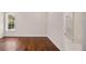 Bedroom featuring wood floors, window, and bathroom with marble shower at 8707 Nw 31St Lane Rd, Ocala, FL 34482