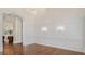 Dining room with hardwood floors, classic chandelier and decorative wall sconces and white wall paneling at 8707 Nw 31St Lane Rd, Ocala, FL 34482