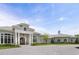Beautiful home with stone accents, arched windows, a paved driveway, and meticulously maintained landscaping at 8707 Nw 31St Lane Rd, Ocala, FL 34482