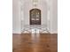 Grand foyer boasting a striking marble tile inlay, hardwood floors, and an elegant double-door entry at 8707 Nw 31St Lane Rd, Ocala, FL 34482