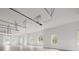 Bright garage space features tile flooring, white walls, and window bringing in light at 8707 Nw 31St Lane Rd, Ocala, FL 34482