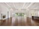 Spacious living room with a fireplace, hardwood floors, recessed lighting and folding glass doors to the outside at 8707 Nw 31St Lane Rd, Ocala, FL 34482