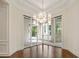Modern living space with glass doors and view to the outdoor patio and entertainment area at 8707 Nw 31St Lane Rd, Ocala, FL 34482