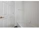 Bathroom displaying a shower and tub with white tiles and wood grain floors at 294 Lake Doe Blvd, Apopka, FL 32703