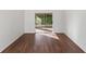 Empty Living Room with Sliding Glass Door and wood flooring with outside lighting visible at 294 Lake Doe Blvd, Apopka, FL 32703
