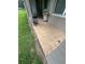 An outdoor space with a barbecue grill, small table, chairs and tiled flooring at 440 Bay Leaf Dr, Kissimmee, FL 34759