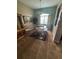 Elegant dining room features a glass-top table, decorative rug, and stylish lighting fixture at 440 Bay Leaf Dr, Kissimmee, FL 34759