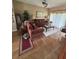 Cozy living room with elegant sofas, decorative rug, and ample natural light at 440 Bay Leaf Dr, Kissimmee, FL 34759