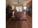 Comfortable living room featuring vintage-style furnishings and a ceiling fan at 440 Bay Leaf Dr, Kissimmee, FL 34759