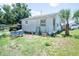 Backyard view of house with palm tree at 7043 Curtis Ave, Groveland, FL 34736