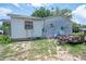 Backyard view of house with lawn at 7043 Curtis Ave, Groveland, FL 34736