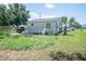 View of backyard with a small palm tree at 7043 Curtis Ave, Groveland, FL 34736