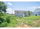 Backyard view with lawn and plants at 7043 Curtis Ave, Groveland, FL 34736