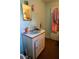 Bathroom featuring a turquoise sink, peeling walls, and outdated fixtures at 7043 Curtis Ave, Groveland, FL 34736