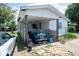 Carport with a vintage car and brick driveway at 7043 Curtis Ave, Groveland, FL 34736