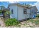 Back view of house with small garden at 7043 Curtis Ave, Groveland, FL 34736