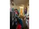 Hallway shows clutter and storage overflowing into the space with view into a bathroom at 7043 Curtis Ave, Groveland, FL 34736