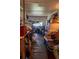 Kitchen is crowded with personal items throughout the space, creating a cluttered environment at 7043 Curtis Ave, Groveland, FL 34736