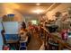 This cluttered pantry features multiple storage shelves with containers and boxes at 7043 Curtis Ave, Groveland, FL 34736