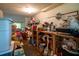 This cluttered pantry features shelving units filled with boxes and containers at 7043 Curtis Ave, Groveland, FL 34736