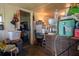 Cluttered room features various household items, appliances, and personal belongings at 7043 Curtis Ave, Groveland, FL 34736