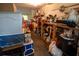 Cluttered storage room with miscellaneous items, containers and household supplies at 7043 Curtis Ave, Groveland, FL 34736