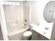 Bathroom featuring a tub-shower combo with a white vanity and oval mirror at 11315 Cypress Shore Ct, Clermont, FL 34711
