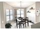 Cozy dining room with natural light, chandelier, and decor at 11315 Cypress Shore Ct, Clermont, FL 34711