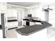 Kitchen features a large island, stainless steel appliances, and white cabinets at 11315 Cypress Shore Ct, Clermont, FL 34711