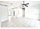Bright living room boasting tile floors, recessed lighting, and an open layout perfect for entertaining at 11315 Cypress Shore Ct, Clermont, FL 34711