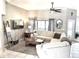 Comfortable living room featuring tile floors, a ceiling fan, and stylish décor at 11315 Cypress Shore Ct, Clermont, FL 34711
