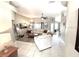 Spacious living room with tile flooring, a ceiling fan, and a cozy seating area for relaxation at 11315 Cypress Shore Ct, Clermont, FL 34711