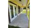 Covered patio with tiled flooring and French doors, perfect for outdoor living at 13074 Sw 104Th Ln, Dunnellon, FL 34432