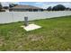 Sprawling backyard featuring a well and sturdy white fence offering privacy and security at 13074 Sw 104Th Ln, Dunnellon, FL 34432