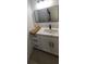 Modern bathroom featuring a sleek vanity with a square mirror and stylish fixtures at 13074 Sw 104Th Ln, Dunnellon, FL 34432