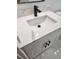 Bathroom vanity featuring modern white countertops with a square undermount sink and fixtures at 13074 Sw 104Th Ln, Dunnellon, FL 34432