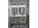 Modern bathroom with double vanity, sleek black fixtures, and elegant marble accents at 13074 Sw 104Th Ln, Dunnellon, FL 34432