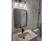 Stylish bathroom featuring a modern sink, quartz countertop, and updated fixtures and a door to the toilet room at 13074 Sw 104Th Ln, Dunnellon, FL 34432