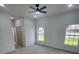 New bedroom with two windows and a ceiling fan at 13074 Sw 104Th Ln, Dunnellon, FL 34432