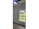 Light bedroom with a ceiling fan and a bright window at 13074 Sw 104Th Ln, Dunnellon, FL 34432