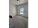Bright bedroom with a window offering natural light and neutral color flooring at 13074 Sw 104Th Ln, Dunnellon, FL 34432