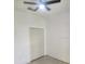 Bedroom featuring a ceiling fan and closet at 13074 Sw 104Th Ln, Dunnellon, FL 34432